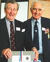 Bob Willis presents the first box of Mosquito archival material to Major-General Henry Woods.