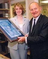 Patron, Lord Jellicoe presents Claire Harder with a framed scroll to commemorate the launch of the new Centre. (Courtesy of Jack Hickes Photographers Ltd)