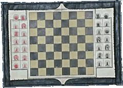 A travel chess set with pieces made from slivers of painted plastic located in slots in the board