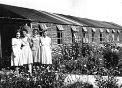 'This was taken outside Block A. I am on the left and Jane is second from right. We made the garden, the plants were given to us by our workmates.'