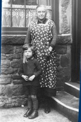 With Grandma outside the back door at Langley Street.