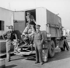The BBC party (Talbot in Centre) with 'Belinda'; the BBC recording truck. The thirty hundred weight army truck was memorably described by Godfrey as "large and fat and friendly-looking; a bit slow, always over-burdened, long-suffering but great hearted".