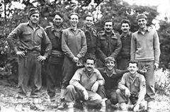 "Souvenir before the last operation" Standing (left to right): An American O.G., Captain M. Carver, Sergeant F. Langley, Major Hill, Captain Anghelatos, O.G. Larry, and O.G. 'Top'. Kneeling: Jecchinis in the middle of two O.G.'s