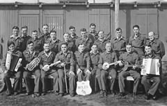 Members of the Moles Concert party in Waldenburg coalmining camp (about 1.5 miles from pit) 1944. Hopper was producer etc. for most of the concert party's 'existence' concerts. The party was made up of Australians, New Zealanders, South Africans and British 1944 - 45.
