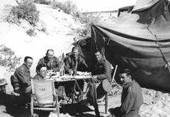 B Squadron Officers' Mess near Tobruk, January 1942. From left to right: Captain E G S Smallwood (K.I.A.), Lieutenant Sir A Tichborne Bart, Major D J Hill-Wood MC, Second-Lieutenant J A C Pearce, Captain F A Jarvis MC, Lieutenant The Honourable Robin Maughan.