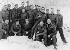 Peter Peel is pictured with hat and pipe, third from the left standing