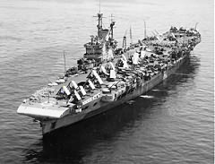 "The ship. H.M.S. Victorious at Leyte, Philippine Islands, May 1945, with the aircraft, Corsairs and Avengers, on deck"