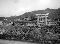 Bomb damage in Nagasaki: "Part of the Mitsubishi Aircraft Factory which was put entirely out of action. Note shelter entrance."