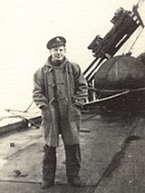 Jimmy Harland - the background shows twisted rails where tanks had rolled over the side during a gale.