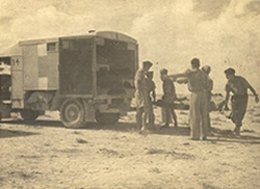 Loading the wounded into ambulances - Alamein
