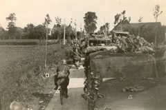 British, French and Belgian soldiers retiring to the coast and Dunkirk, from Belgium, Wednesday morning 29 May 1940. Many fell into action again, including ourselves, before reaching the coast. L Barter. 