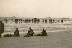 Dunkirk beach, Friday 31 May 1940. British and French troops waiting and watching. L Barter.
