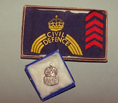Ethel Wappet's Civil Defence arm band and badge.