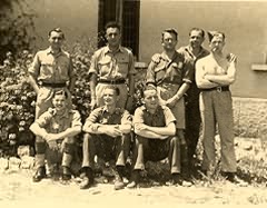 Surgical block staff with Italian POW in the foreground.