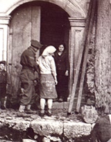 Girl with GI kit bag as a skirt, Pantelleria. G Wooler