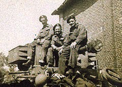 3 members of 2 Troop, 'A' Squadron on a Cromwell turret. CT is the trooper in the middle. 