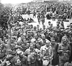 "In the Bag" in Tunisia. One of the many huge collections of Axis prisoners of war during the last days of the fighting in Africa.